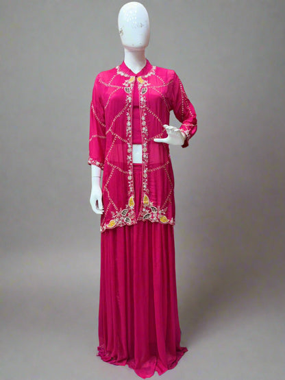 Mannequin wearing a pink embroidered outfit in a store setting